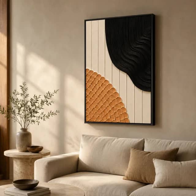 Black Clay Rhythm in a black frame above a linen sofa in a warm living room