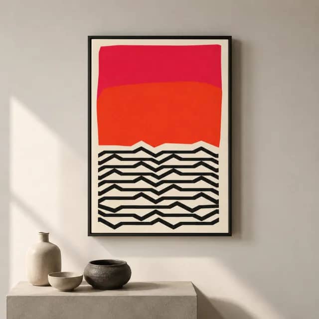 Geometric Sunset Pulse in a black frame on a calm wall above a simple display plinth