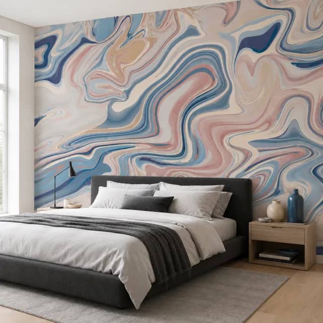 Soft rose and blue marble wallpaper behind a modern bed
