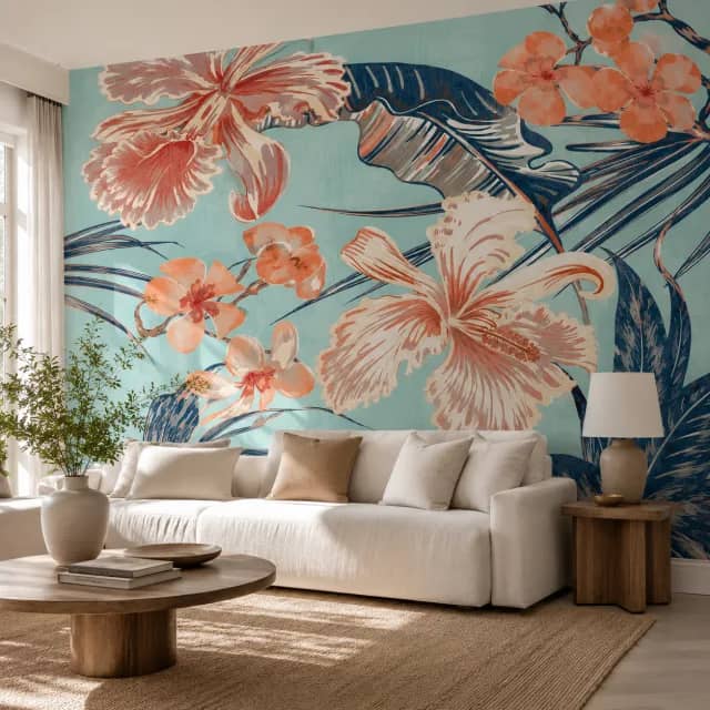 Tropical orchid wallpaper installed on an elegant living room wall behind a light sofa