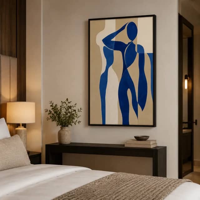 Blue and beige artwork in a black frame in a boutique bedroom suite