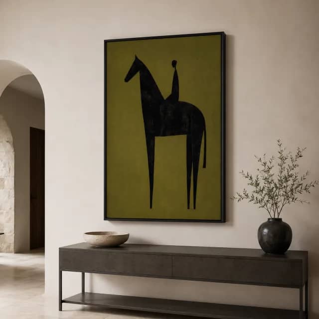 Olive Shadow Rider in a black floater frame above a modern console