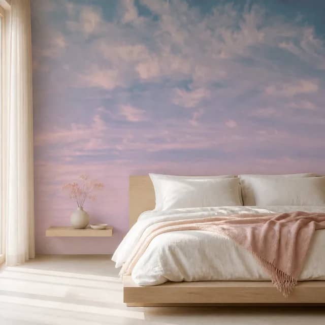 Blush and blue sky mural covering a bright bedroom wall