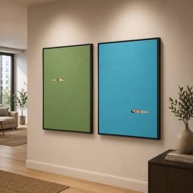 Green and aqua swimmer diptych in black frames in a modern hallway