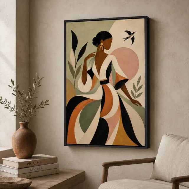 Olive Whisper displayed in a black frame in a warm interior corner with a vase and fabric chair
