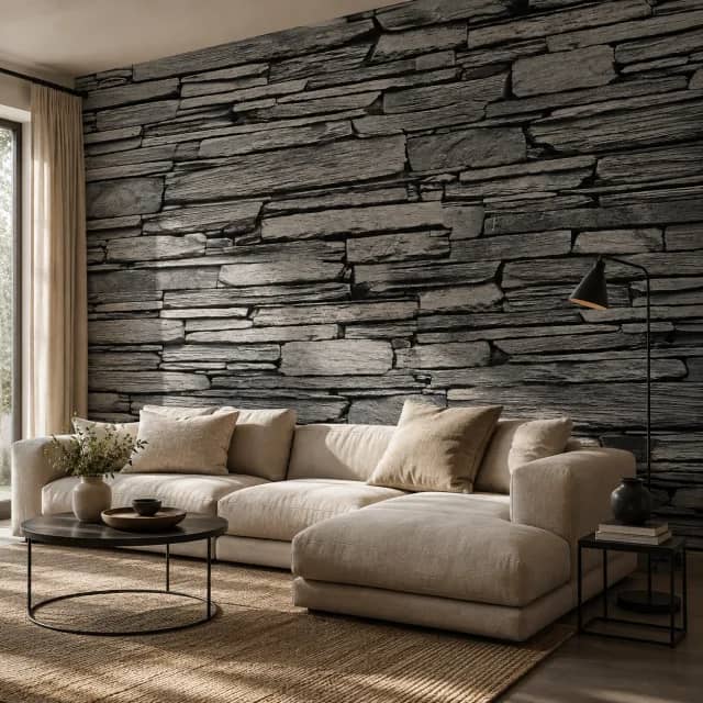 Grey stone wallpaper behind a sofa in a modern living room