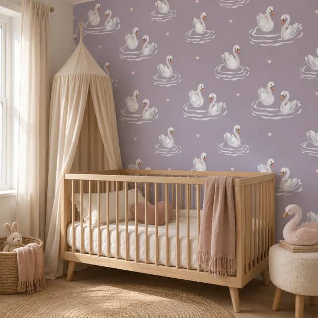 Mauve swan wallpaper behind a wooden crib in a calm nursery