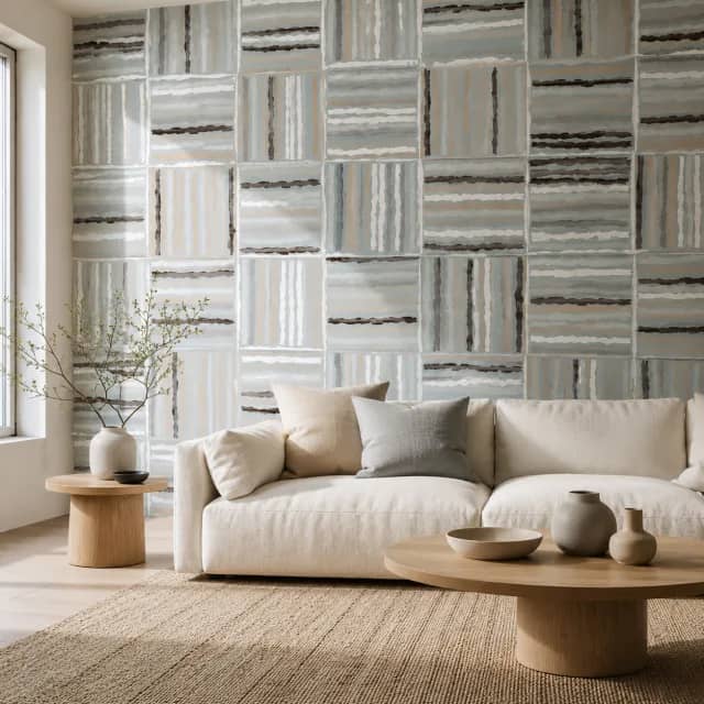 Geometric abstract wallpaper behind a light sofa in a modern living room